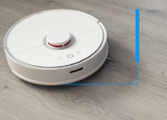 Attachment of bumper strips and nameplates in robotic vacuum cleaners